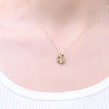 Gin and Grace in collaboration with Smithsonian Museum Collection presents a serene seashell pendant in 14K Yellow gold and Diamond for exclusive everyday look